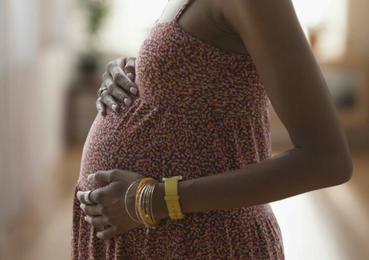 Photo of a pregnant woman at home