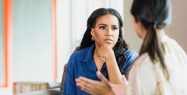 Patient safety partner talking with a clinician