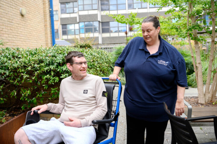 Nurse with a trauma recovery patient in a wheelchair