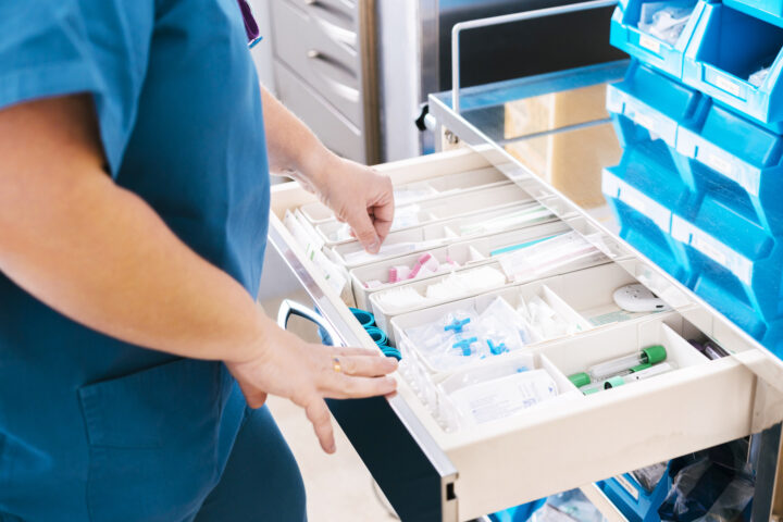 Nurse with medical supplies at hospital