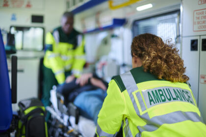 Ambulance crew preparing casualty